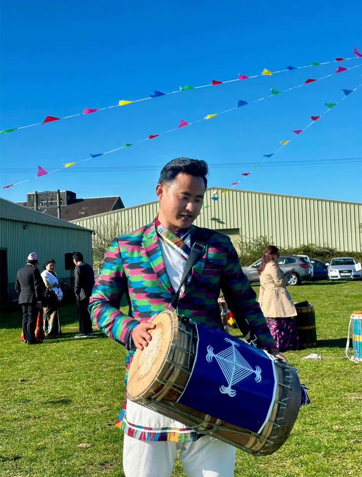 Green t-shirt with The Band graphic